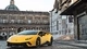 Картинка: Жёлтый Lamborghini Huracan Coupe на фоне старых зданий