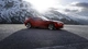 Картинка: BMW Zagato стоит на фоне снежных гор и освещается солнечными лучами