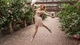 Image: Girl jumping on the background of beautiful spray roses