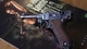 Картинка: Пистолет Luger лежит на журнале