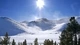 Картинка: Солнечное светило над зимними горами