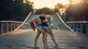 Картинка: Две гимнастки держат мяч спиной стоя на мосте