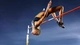 Картинка: Спортсменка выполнила прыжок через перекладину
