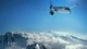 Image: The plane flies over the snow-capped mountains
