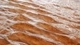 Image: Ripples of water on a background of sand