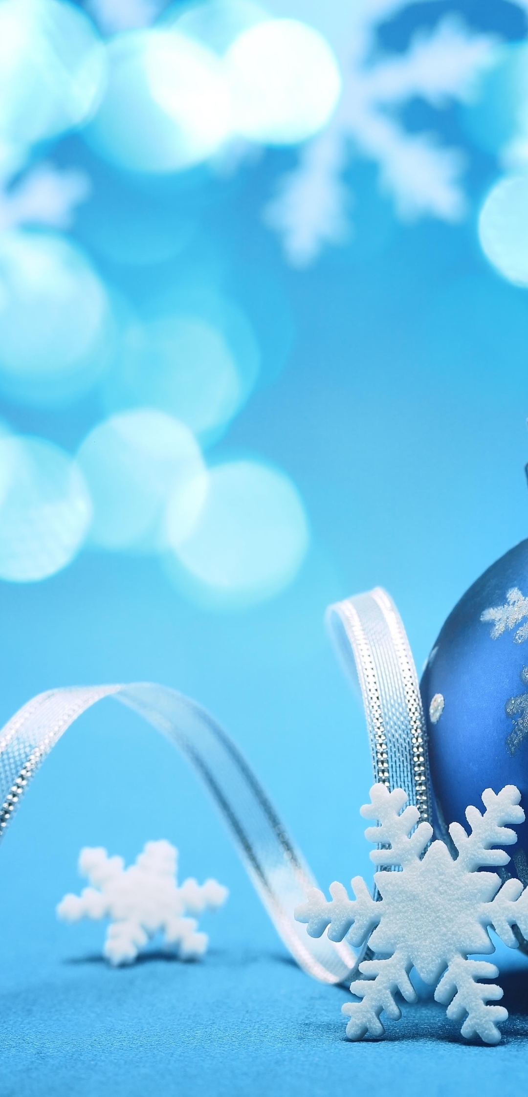 Image: New year, ball, toy, ribbon, blue background, snowflakes