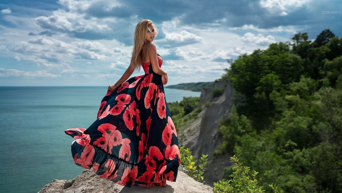 Image: Girl, dress, blonde, rocks, sea, sky, clouds, horizon, nature