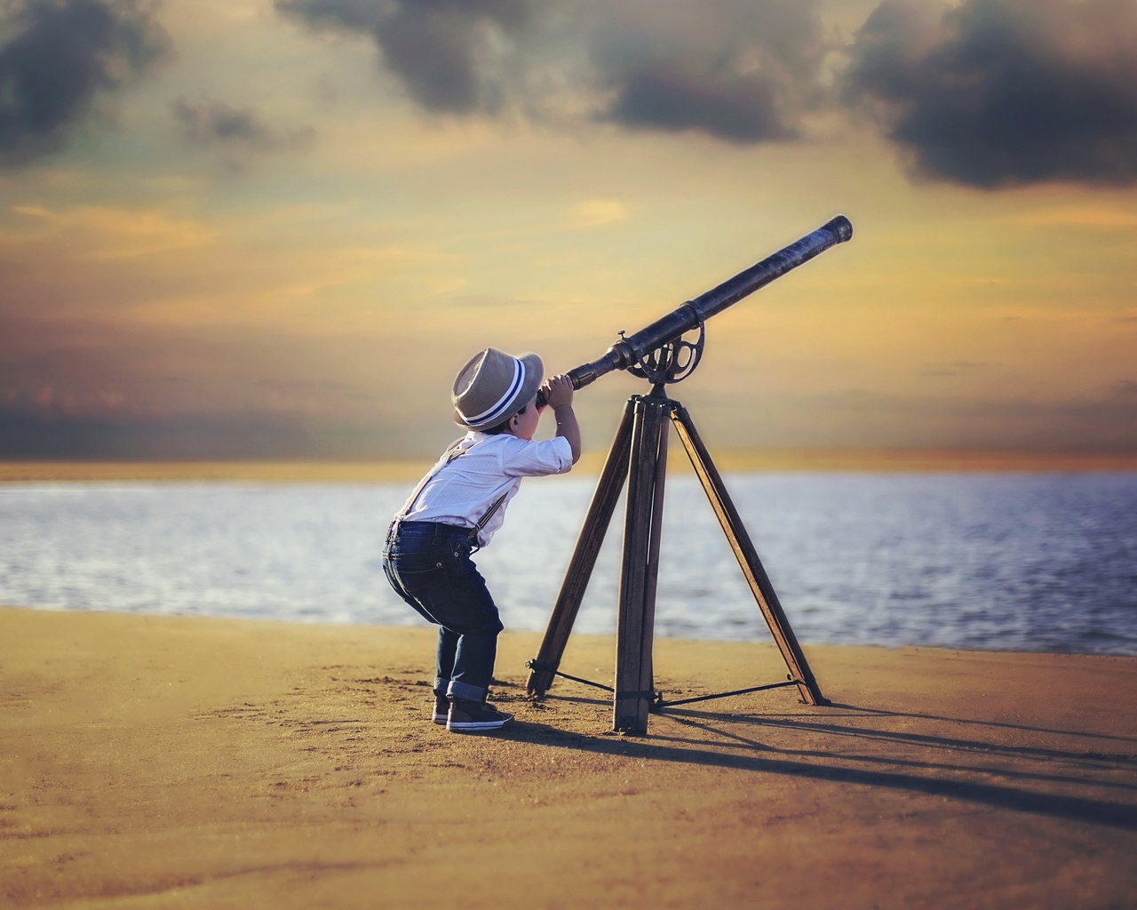 Image: Boy, telescope, beach, sand, sea, sky