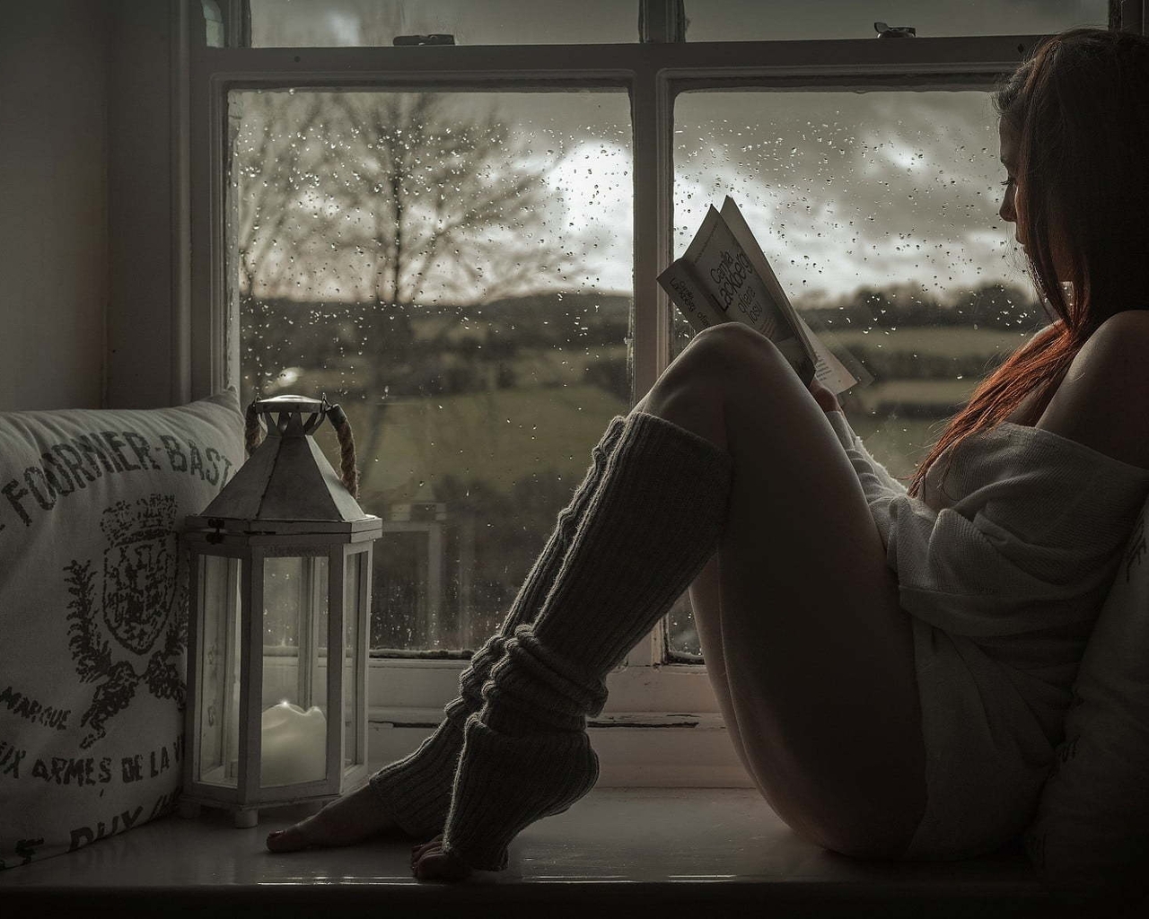 Image: Girl, sitting, reading, book, windowsill, window, rain, pillow