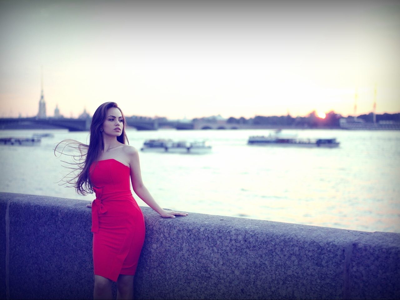 Image: Girl, brunette, long hair, red dress, figure, posing, river, water, waterfront, blurred background