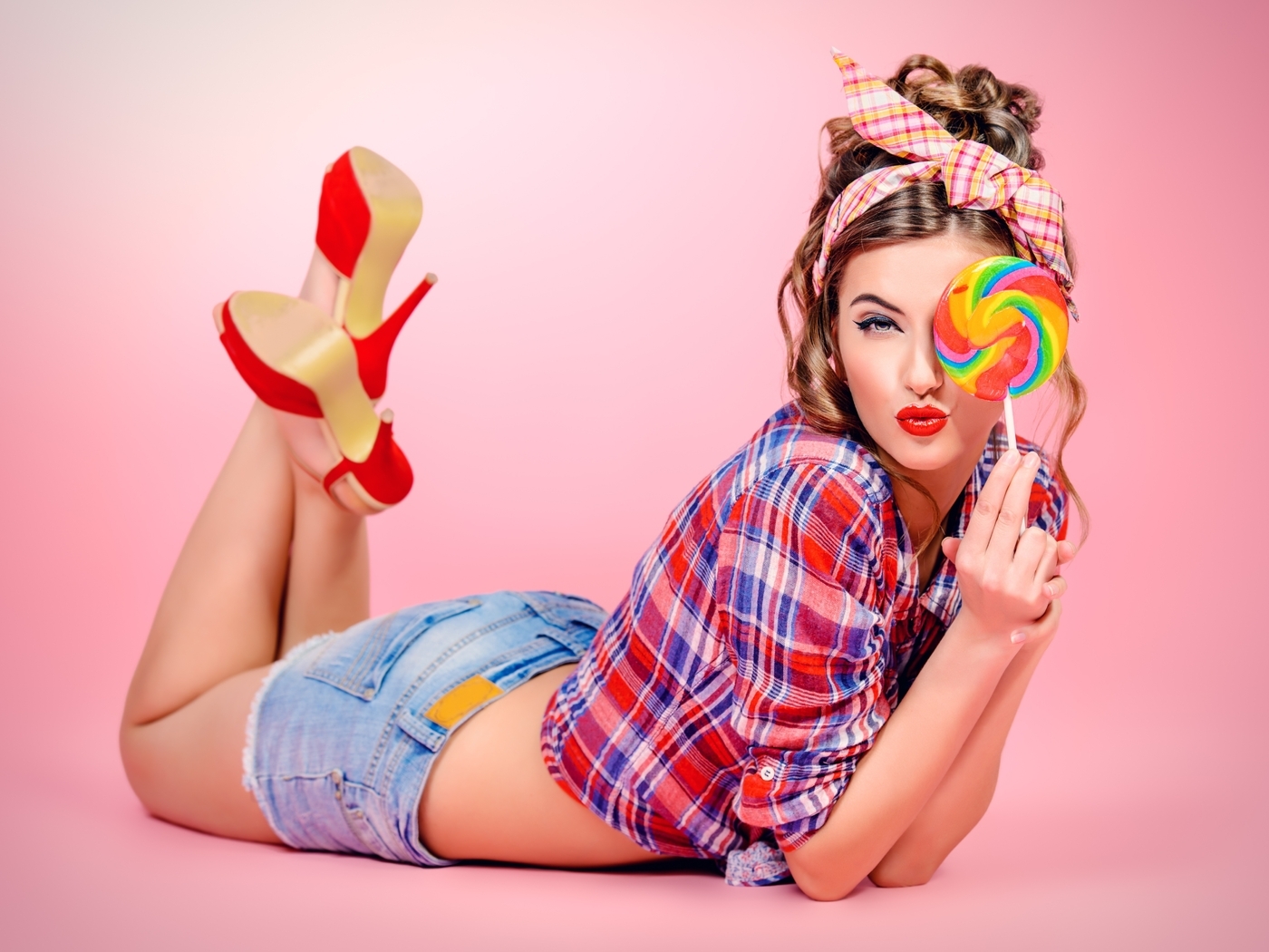 Image: Girl, squints, caramel, style, laying, shoes, feet, shirt, pink background