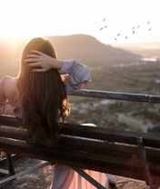 Image: Girl, brunette, long hair, sitting, back, bench, sunset, flock of birds, nature