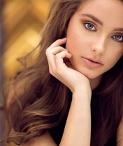 Image: Girl, brown hair, blue eyes, face, hand near a face
