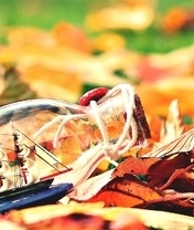 Image: Bottle, little ship, sails, mast, leaves, autumn