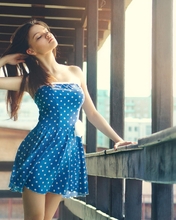 Image: Brunette, girl, hair, blue dress, polka dots, railings