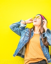 Image: Fun, mood, girl, glasses, jeans, yellow background