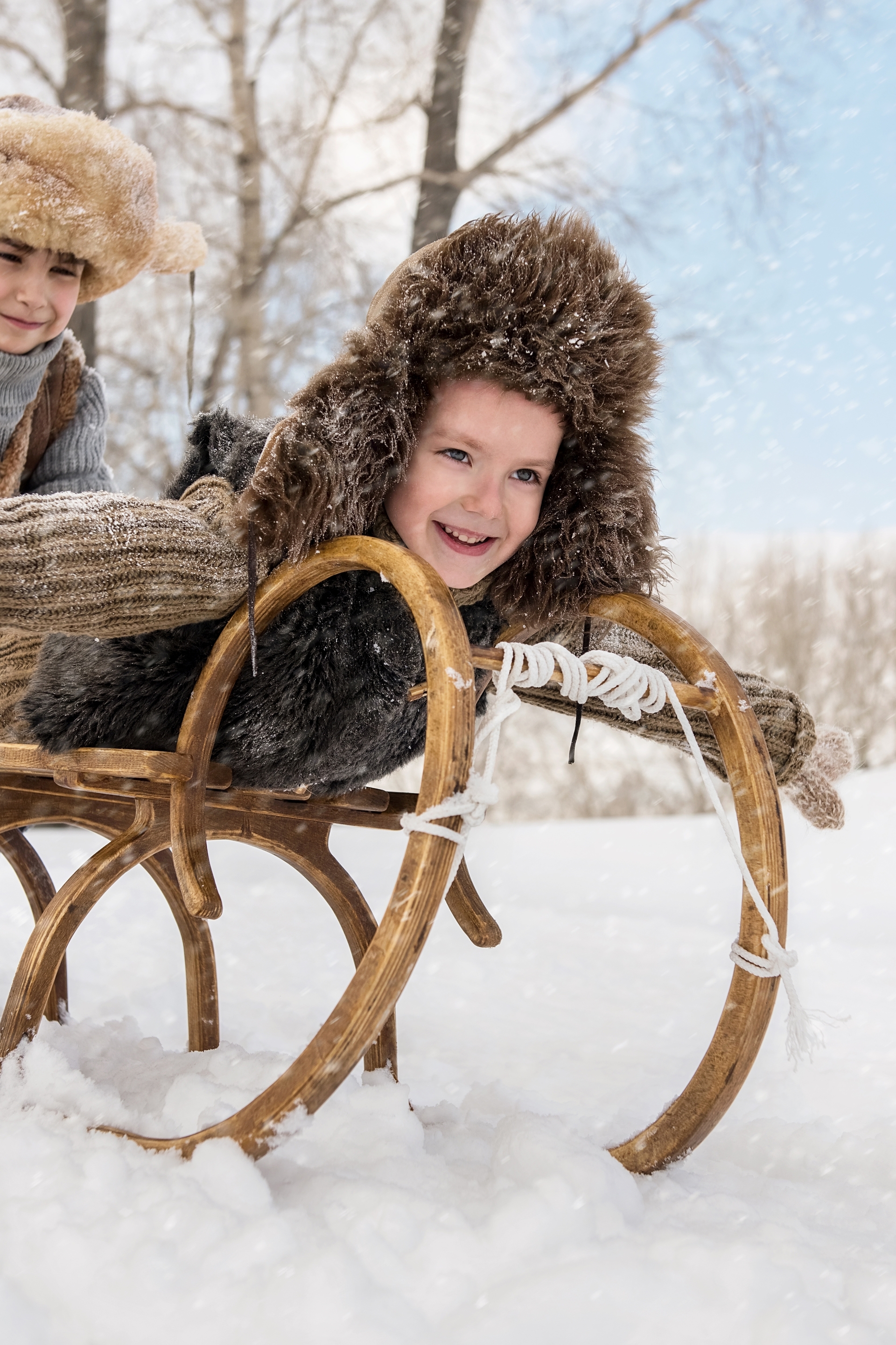 Image: Boys, children, hat, winter, snow, ride, sled, trees, smile, mood