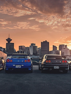 Картинка: Nissan, GTR, R35, R32, R34, авто, здания, высотки, небо, облака, закат