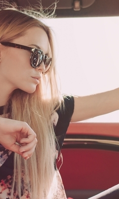 Image: Blonde girl, glasses, steering wheel, interior, car