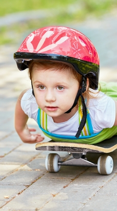 Image: Boy, child, skating, skate, helmet, lying