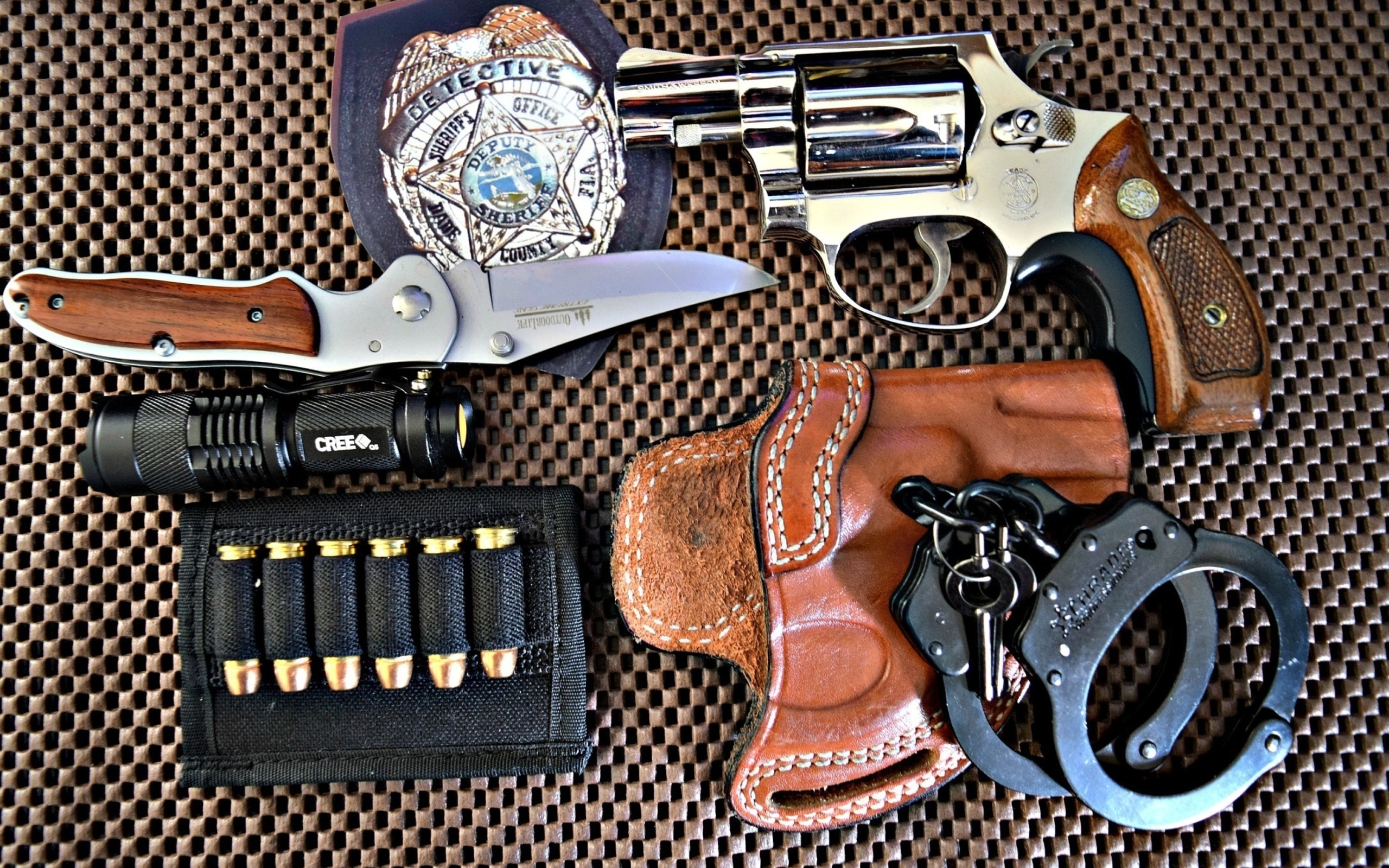 Image: Ammo, holster, flashlight, knife, badge, gun, clip, bullets, handcuffs, keys