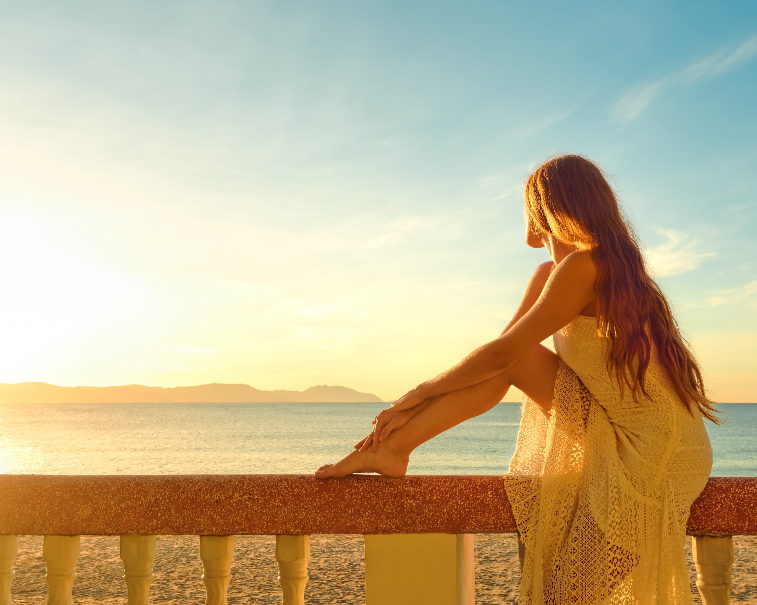 Image: Girl, dress, sitting, railing, sea, mountains, sky, sunset
