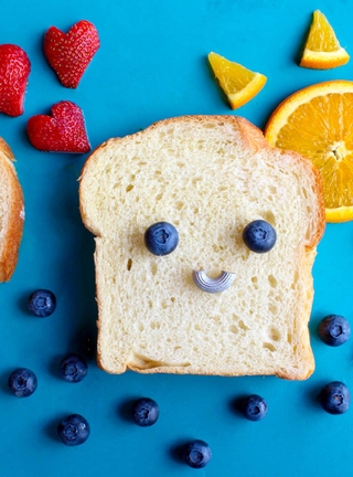 Image: Bread, blueberries, strawberries, berries, orange, spaghetti, sun, face, smile, mood, blue background
