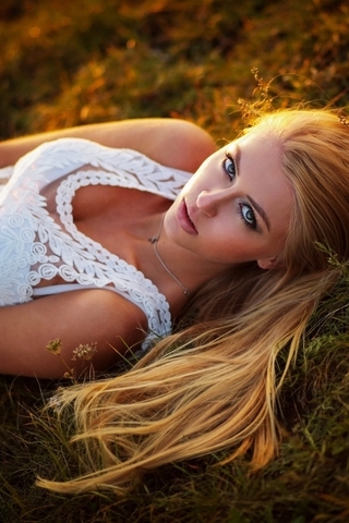 Image: Blonde, eyes, lies, grass, field, hair, sunset, white, girl