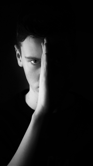 Image: Male, man, face, hand, dark, black background