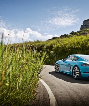 Image: Porsche 718 Cayman, blue, car, highway, road, pavement, grass, sky