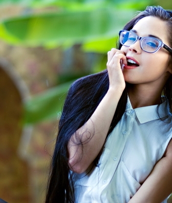 Image: Girl, long-haired, glasses, smile, look, sitting