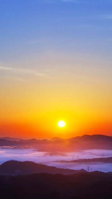 Image: Sky, sun, sunset, mountains, fog, power lines