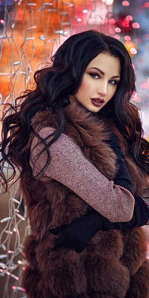 Image: Girl, brunette, coat, vest, fur, garland, holiday, bokeh