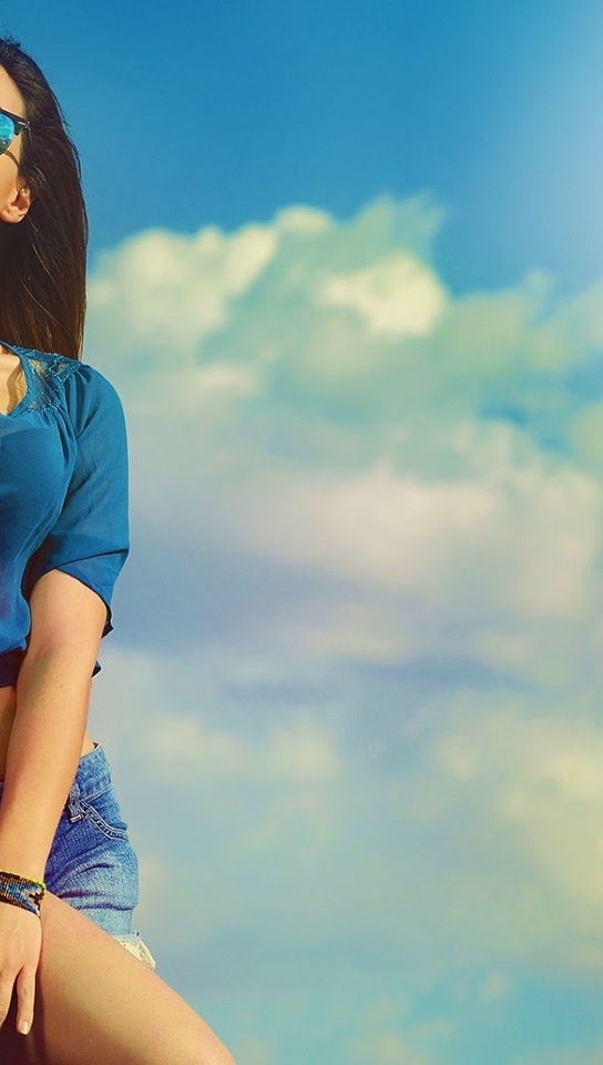 Image: Girl, brunette, blouse, shorts, glasses, sky, clouds