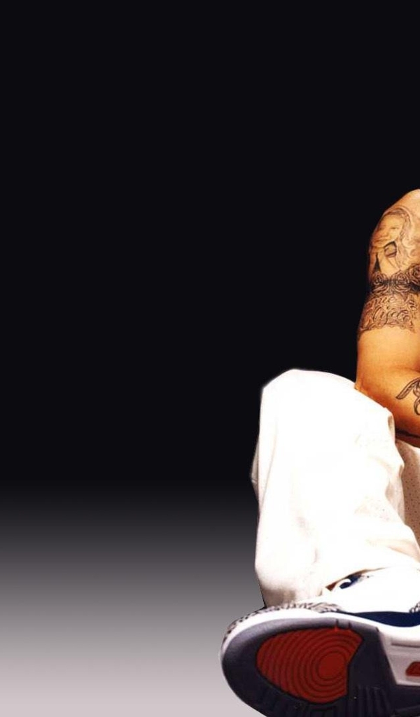 Image: Eminem, musician, rapper, floor, sitting, tattoo