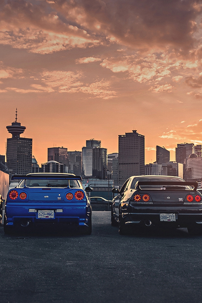 Картинка: Nissan, GTR, R35, R32, R34, авто, здания, высотки, небо, облака, закат