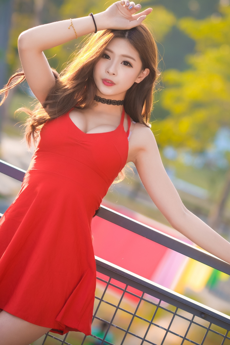 Image: Girl, Asian, hair, dress, red, fence, trees, blurring