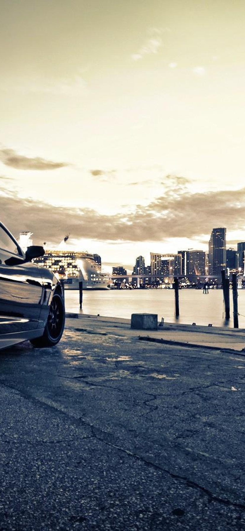 Image: Chevrolet Camaro, dark, stop lights, city, skyscrapers, buildings, river, embankment, gray sky