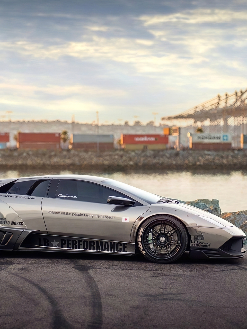 Картинка: Lamborghini, murcielago, LB Performance, суперкар, вода, порт, следы, контейнеры, краны, небо