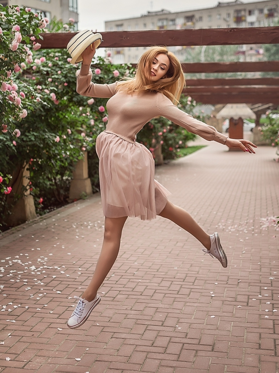 Image: Girl, pink, dress, hat, smiling, jumping, flowers, roses, shrub, garden, Christina Kardava